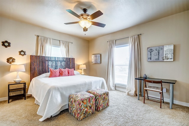 bedroom featuring light carpet and ceiling fan