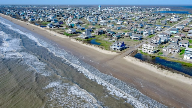 bird's eye view featuring a beach view and a water view