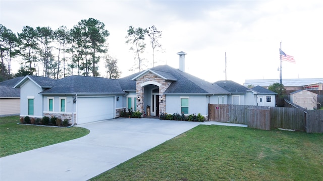 single story home featuring a front yard and a garage