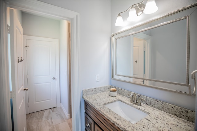 bathroom with vanity and tile floors