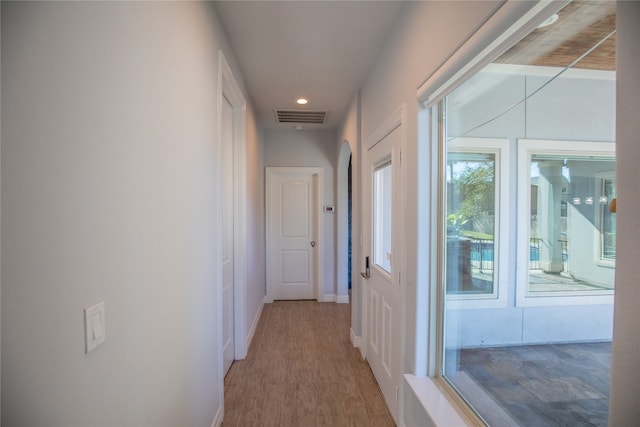 hall with light hardwood / wood-style flooring