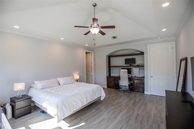 bedroom featuring light hardwood / wood-style floors, ornamental molding, and ceiling fan