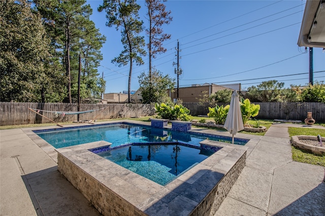 view of pool with an in ground hot tub