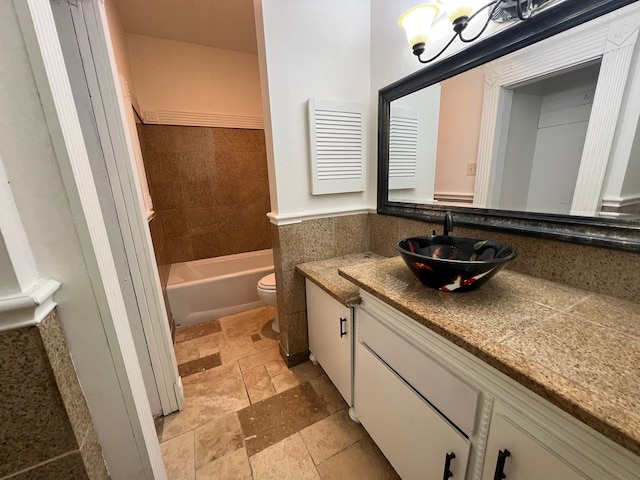 full bathroom featuring shower / bathing tub combination, toilet, tile floors, and vanity