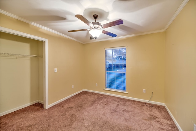 unfurnished bedroom featuring light carpet, ornamental molding, a closet, and ceiling fan