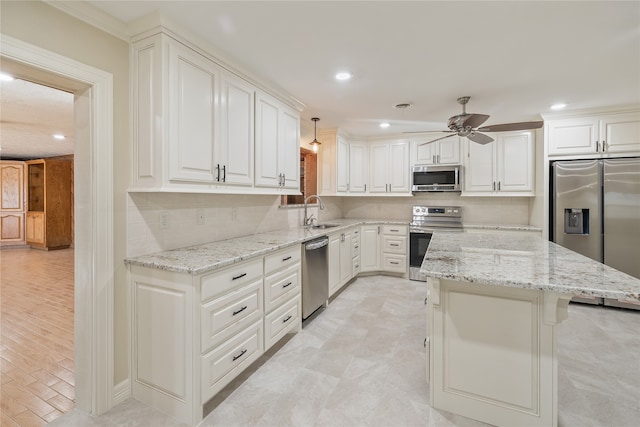 kitchen with white cabinetry, light stone counters, ceiling fan, and stainless steel appliances