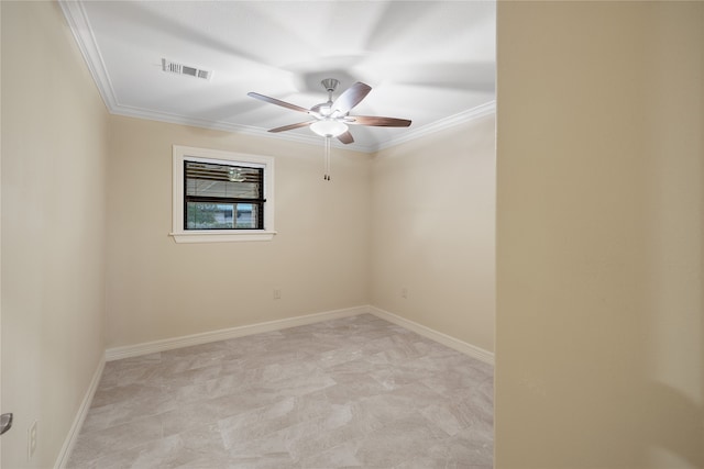 spare room with ornamental molding and ceiling fan