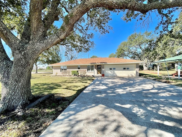 single story home featuring a front lawn and a garage