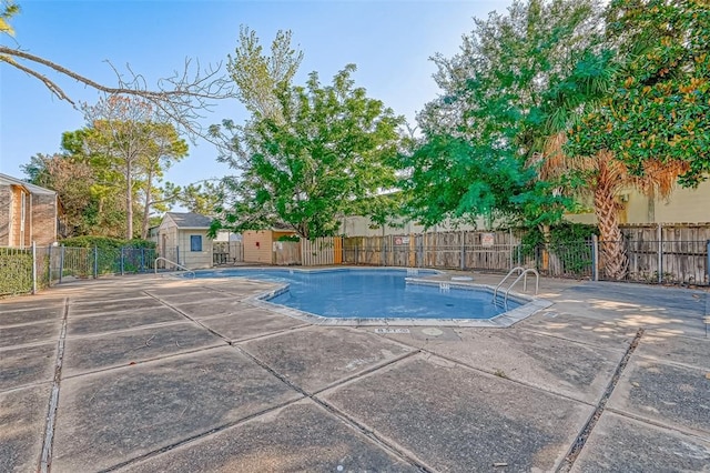 view of swimming pool with a patio area