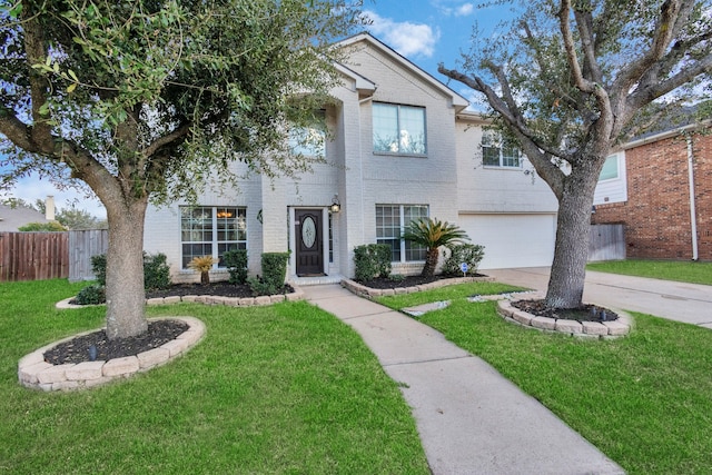 front of property with a front lawn and a garage