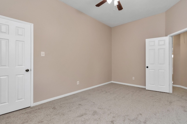 empty room with light colored carpet and ceiling fan