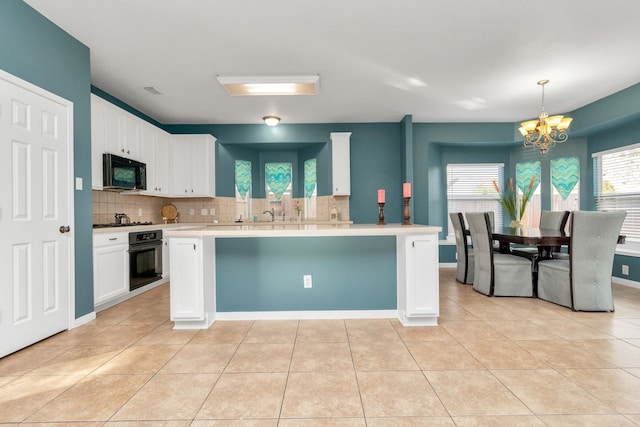 kitchen with white cabinets, light tile floors, tasteful backsplash, and black appliances