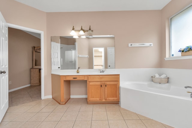 bathroom featuring vanity, tile flooring, and a washtub