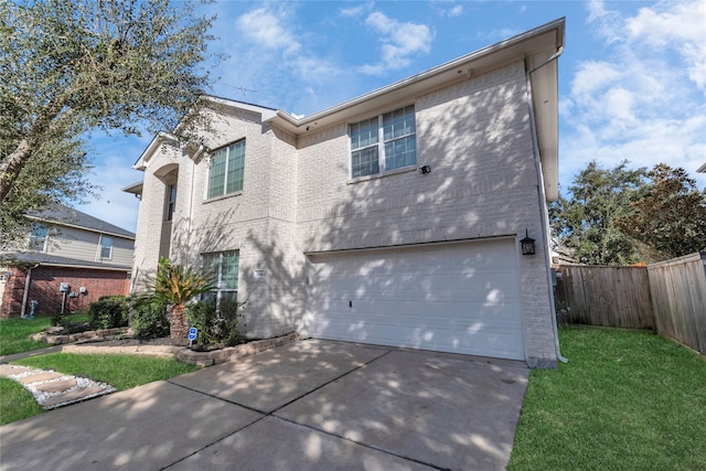 view of front facade featuring a front lawn and a garage