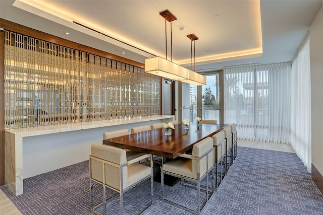 dining room featuring a tray ceiling