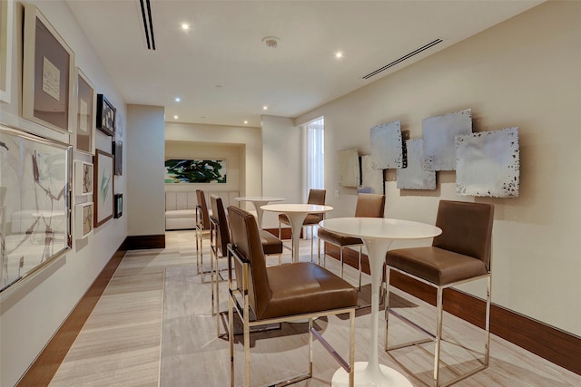 dining area with light hardwood / wood-style floors