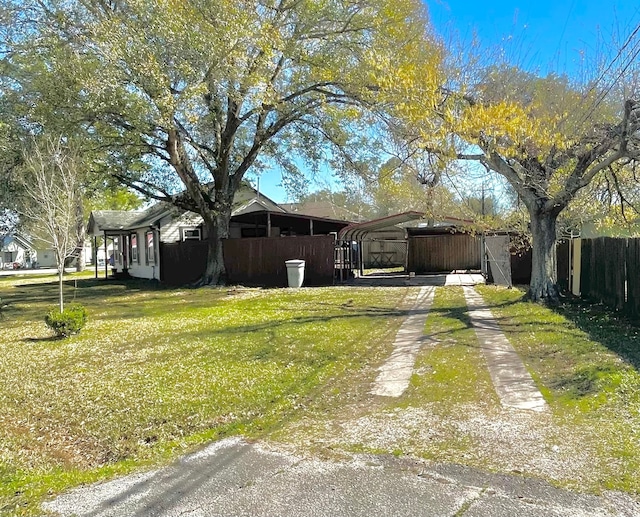 exterior space featuring a front yard and a carport