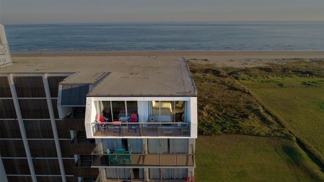 exterior space with a beach view and a water view