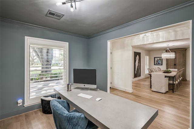 office with an inviting chandelier, crown molding, and light hardwood / wood-style flooring