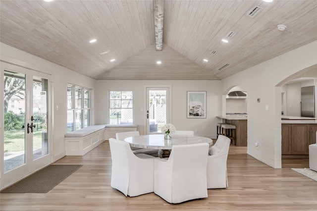 dining room featuring wooden ceiling, french doors, a healthy amount of sunlight, and light hardwood / wood-style flooring