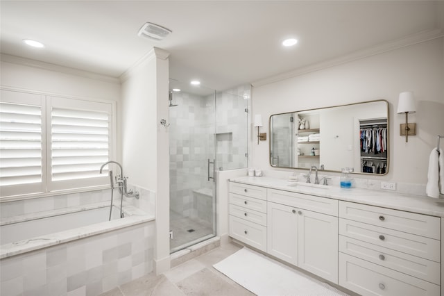 bathroom featuring ornamental molding, tile floors, vanity, and independent shower and bath