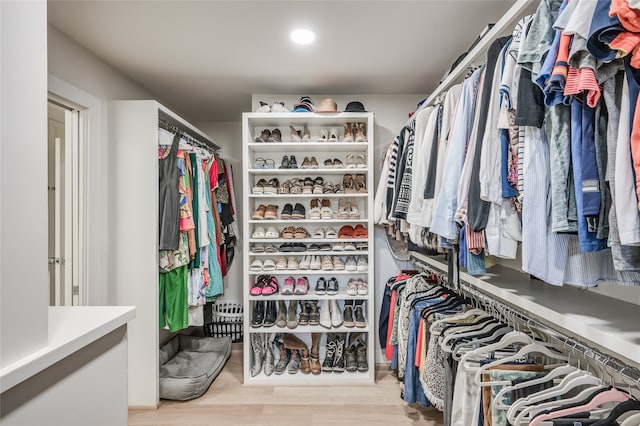 walk in closet featuring light hardwood / wood-style floors