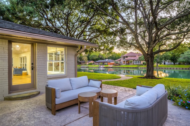 view of patio featuring an outdoor living space and a water view