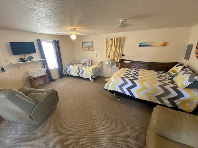 bedroom featuring a textured ceiling, carpet, and ceiling fan