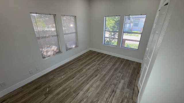 spare room featuring dark hardwood / wood-style flooring