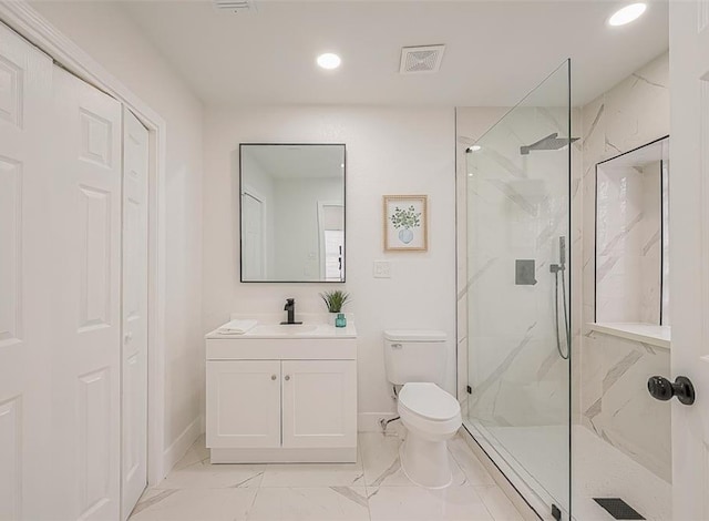 bathroom with an enclosed shower, tile flooring, vanity, and toilet