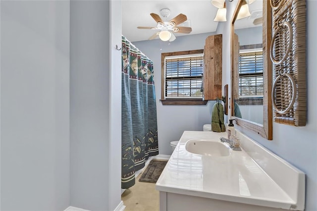 bathroom featuring vanity, ceiling fan, and toilet