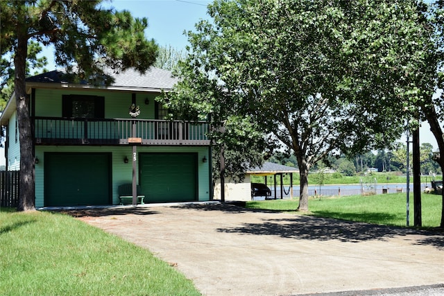 front facade with a garage and a front yard