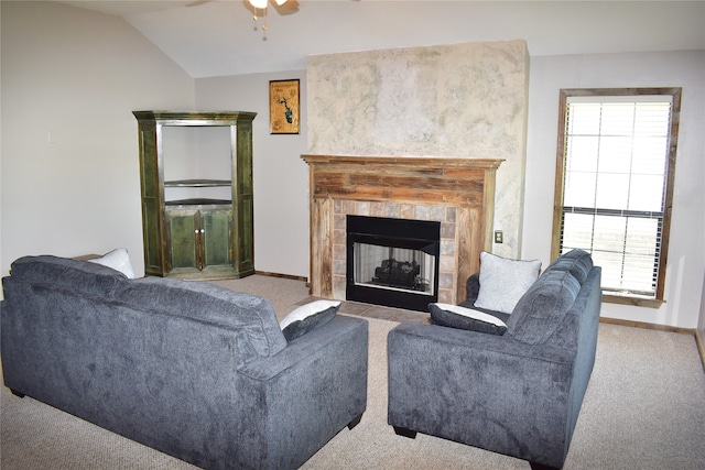 living room featuring a fireplace, light carpet, plenty of natural light, and ceiling fan