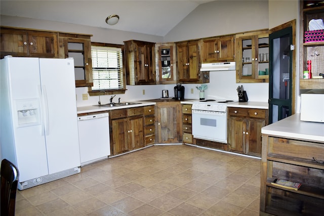 kitchen featuring lofted ceiling, sink, and white appliances