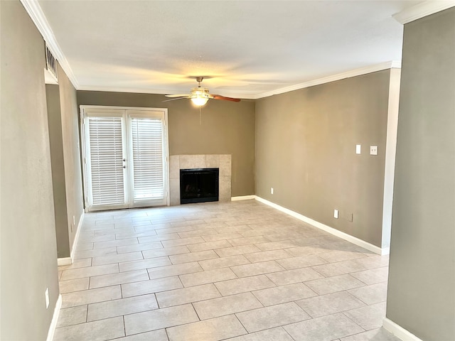 unfurnished living room featuring ceiling fan, a tile fireplace, ornamental molding, and light tile floors