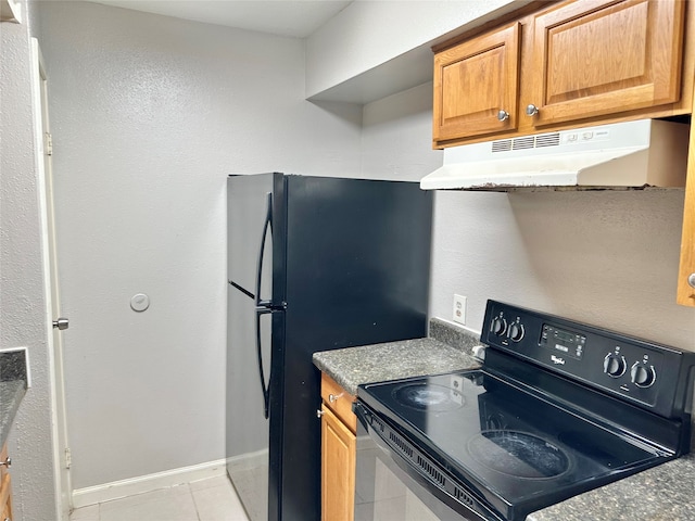 kitchen featuring light tile flooring and black range with electric cooktop