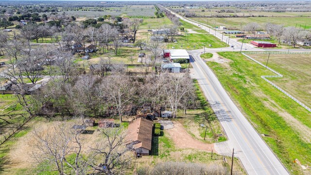 birds eye view of property with a rural view