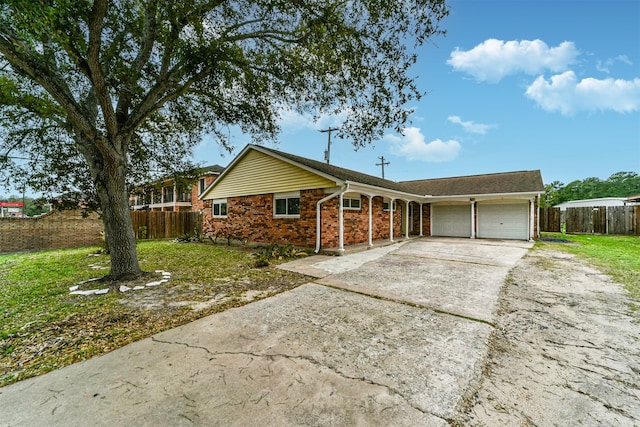 ranch-style home with a front lawn and a garage