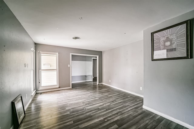 empty room featuring dark hardwood / wood-style floors