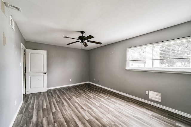 empty room featuring ceiling fan and hardwood / wood-style flooring