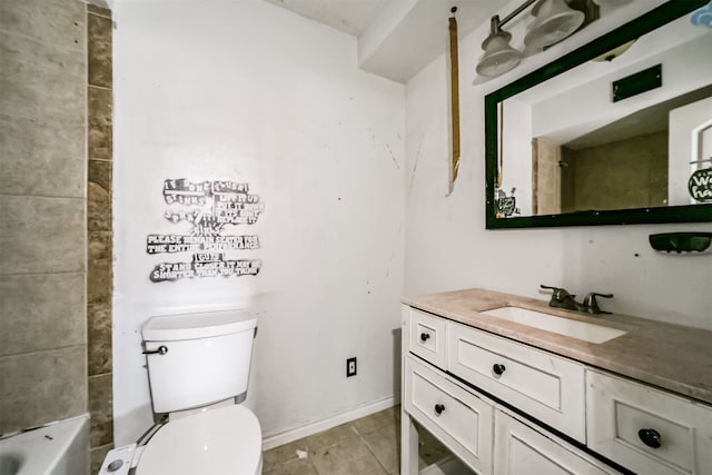 bathroom featuring toilet, vanity, and tile flooring