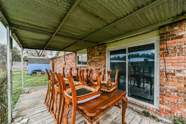 wooden deck with a storage unit