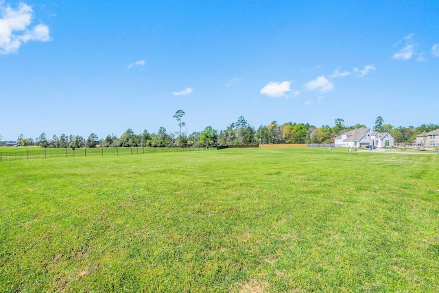 view of yard with a rural view