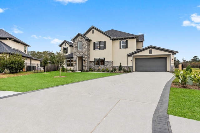 view of front of home featuring a garage and a front yard