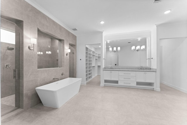 bathroom featuring crown molding, vanity, separate shower and tub, and tile walls