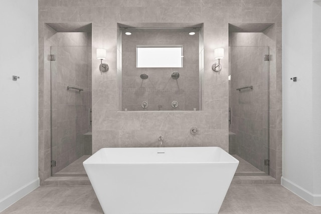 bathroom featuring shower with separate bathtub