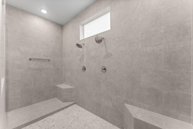 bathroom with a tile shower