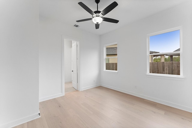 unfurnished room with ceiling fan and light hardwood / wood-style floors