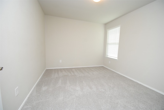 empty room featuring light colored carpet