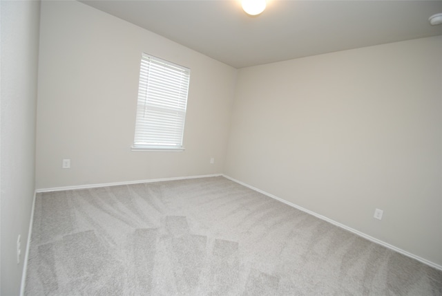 spare room with light carpet